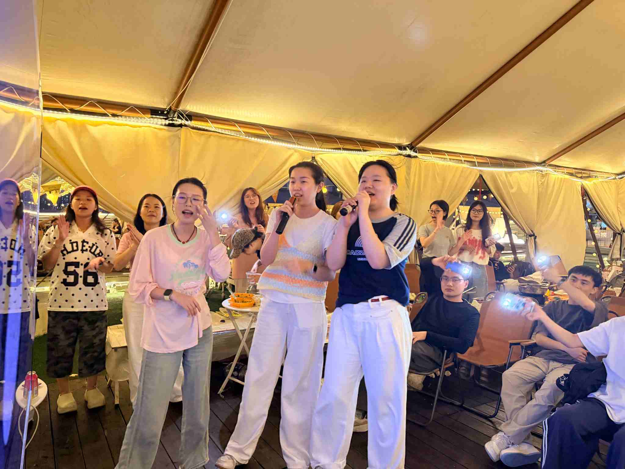 Beneox colleagues singing together at a team event