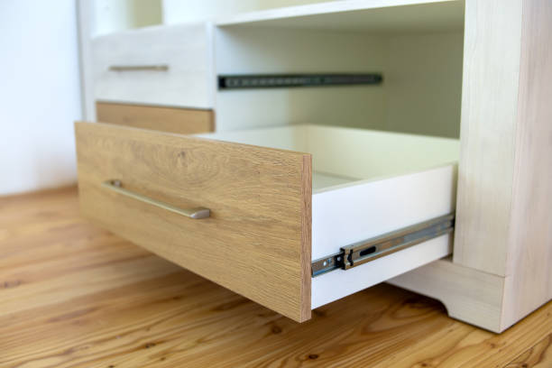 Close up of wooden drawer in contemporary cupboard cabinet.